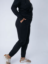 Micah is 5'9, size 10 and wears a size L # Women's Terry Jogger Pants in Black | Fresh Clean Threads