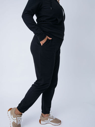 Micah is 5'9, size 10 and wears a size L # Women's Terry Jogger Pants in Black | Fresh Clean Threads