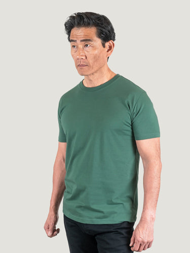 Phil is 6'1, 185lbs and wears a size M # Pine Green Crew Neck Studio Size Medium | Fresh Clean Threads