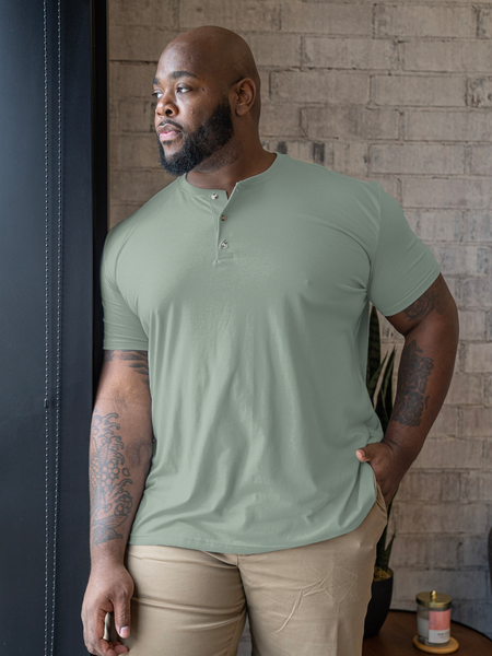 Corey is 6'2", 250LBS and wears a size 3XL # Lifestyle model wears size 3XL | Vintage Green Short Sleeve Henley | Fresh Clean Threads