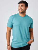 Matheus is 6', 210LBS and wears a size XL # Vintage Blue Crew Neck Tee | Studio Closeup Model Size XL | Fresh Clean Threads