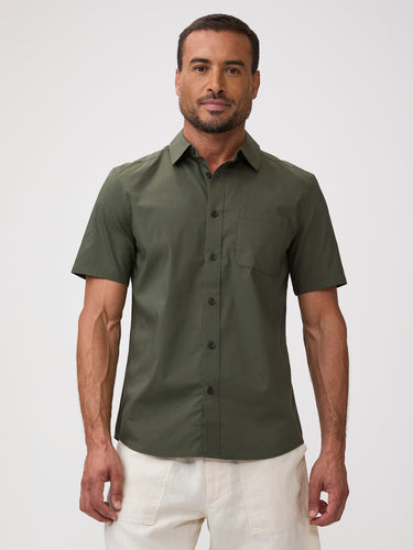 Man wearing a green short-sleeve shirt | Stretch built. Forgiving fit. Army earns its place in your rotation.