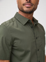 Man wearing army green short-sleeve shirt breathable 115 gsm construction built for warm-weather wear