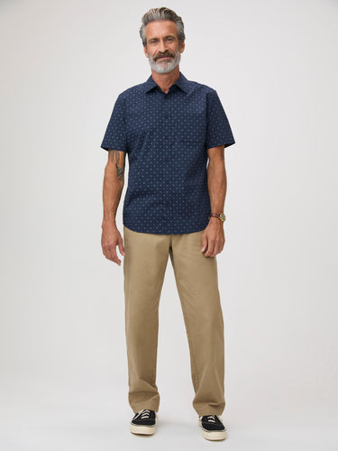 Man wearing a navy print shirt and pants | versatile for casual Fridays, weekends, and evening wear