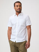 Man wearing a white short-sleeve shirt and brown shorts | a great  fit for every body