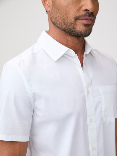Man wearing a white short-sleeve shirt  | Available S–4XL in regular and tall.