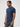 Man wearing a blue t-shirt and gray jeans on a white background