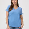 Laurel is 5'7" and wears a size M # Model Wears Size M in Denim Blue V-Neck | Style with your favorite jeans