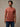 Man wearing copper rust colored crew neck t-shirt