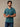 Man wearing a teal blue v-neck t-shirt. the best v-neck tee for layering.