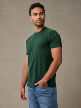 Man wearing moss green crew neck t-shirt