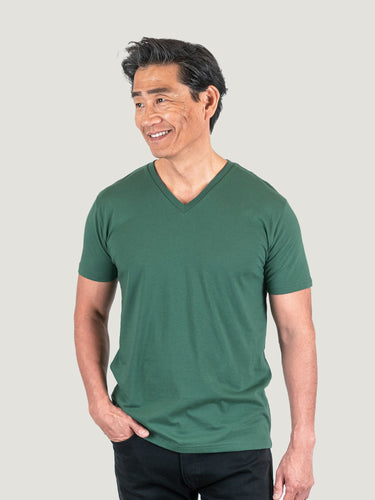 Phil is 6'1, 185lbs and wears a size M # Pine Green V-Neck Studio Size Medium | Fresh Clean Threads