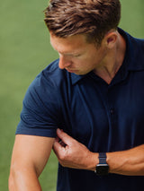 Brad is 5'9", 170LBS and wears a size M # Navy Performance Polo Sleeve Detail Model Size M | Fresh Clean Threads