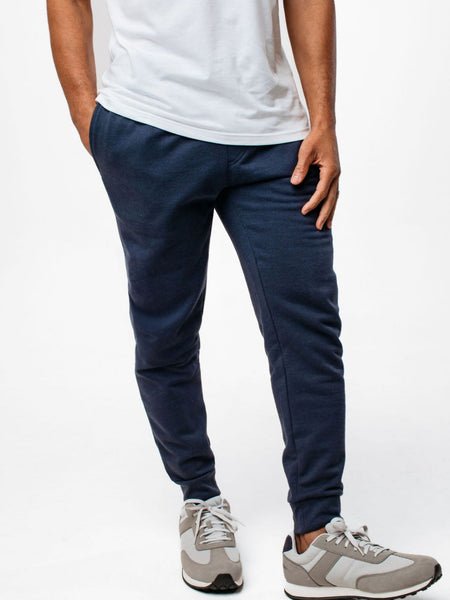 Jarrett is 6', 168lbs and wears a size M # Black + Odyssey Blue Fleece Sweatpants Essentials 2-Pack | Black | Fresh Clean Threads