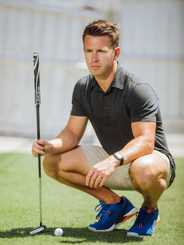 Brad is 5'9", 170LBS and wears a size M # Charcoal Performance Polo Golf Lifestyle Model Size M | Fresh Clean Threads