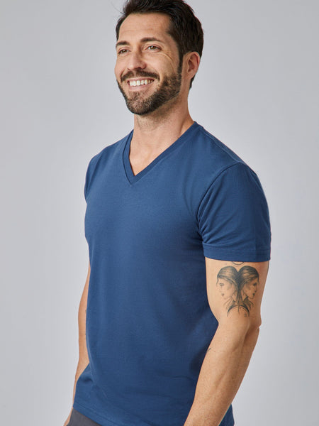 Patrick is 5'10", 163LBS and wears a size M # Steel Blue V-Neck Model Size M | Fresh Clean Threads