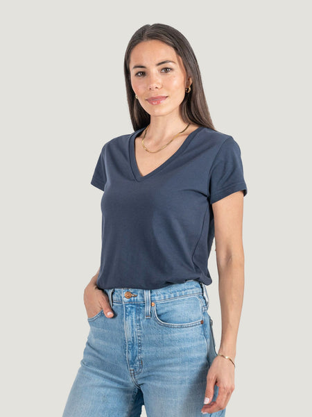 Sarah is 5'8, size 2 and wears a size XS # Women's Odyssey Blue V-Neck Tee | Sarah Studio Size X-Small Tucked | Fresh Clean Threads