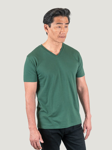 Phil is 6'1, 185lbs and wears a size M # Pine Green V-Neck Studio Size Medium | Fresh Clean Threads