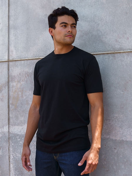 Erick is 6'3, 195LBS and wears a size M # Tall Crew Basic 5-Pack | Black Lifestyle Size Medium | Fresh Clean Threads