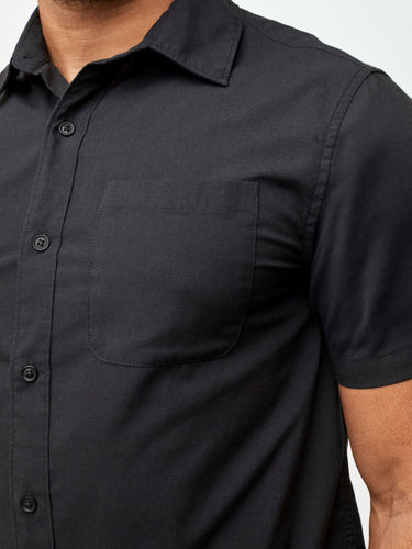 combining style, comfort, and versatility # Black Short Sleeve Stretch Button Up with Chest Pocket | Fresh Clean Threads