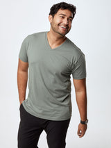 Matheus is 6', 210LBS and wears a size XL # Plain Mercury Green v-neck shirt, available in the Fall Essentials 5-Pack | Fresh Clean Threads