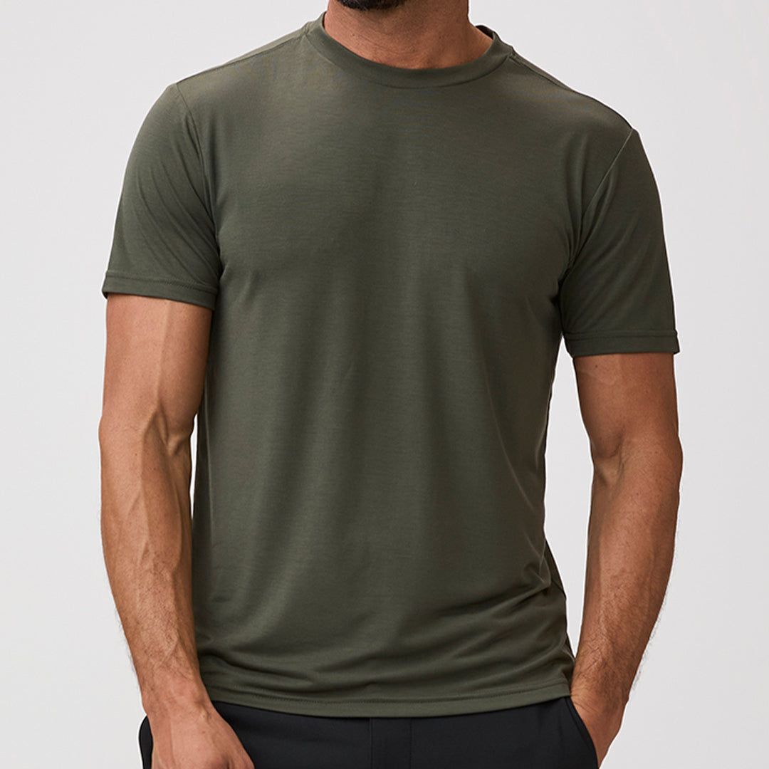 Person wearing a green army t-shirt - best selling army green tees