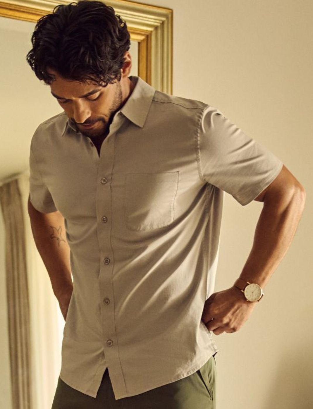 Man wearing a short-sleeve button up shirt | Built to last, wash after wash