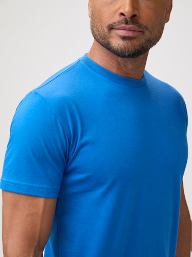 Man wearing a blue t-shirt | Easy pop of color for any outfit Shop the StratuSoft collection