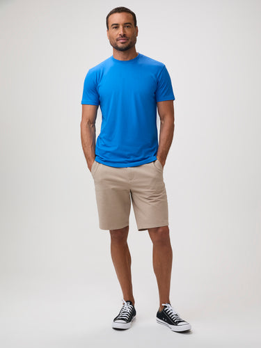 Man wearing an arctic blue t-shirt and khaki shorts | Casual Collection