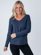 Maddy is 5'8", size 4 and wears a size S # Women's Odyssey Blue V-Neck Long Sleeve | Fresh Clean Threads