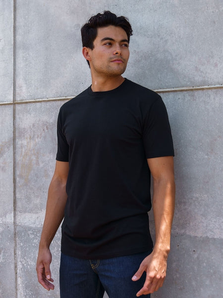 Erick is 6'3, 195LBS and wears a size M # Tall Black Crew Neck Tee | Erick wears size Medium tees