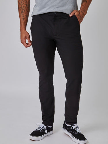 Joe is 6', 180LBS and wears a size 32x30 # Black and Grey Stretch Tech Pant Monochrome 2-Pack | Fresh Clean Threads