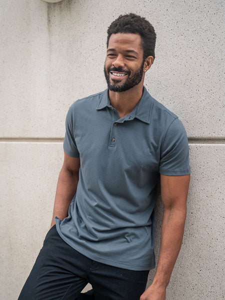 Jarrett is 6', 168lbs and wears a size M # Storm Blue Torrey Polo Lifestyle Size Medium | Fresh Clean Threads