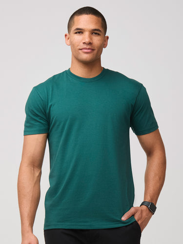 Mikah is 6'1" and wears a size medium # Crew Neck Tee in Dark Emerald | Fall 2024 | Fresh Clean Threads