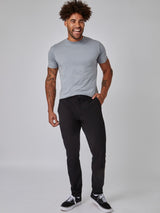 Joe is 6', 180LBS and wears a size 32x30 # Black and Khaki Stretch Tech Pants Staples 2-Pack | Fresh Clean Threads